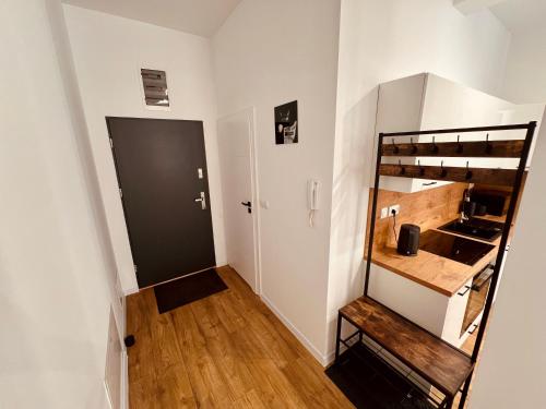 Ένα ή περισσότερα κρεβάτια σε δωμάτιο στο Apartament Warszawska