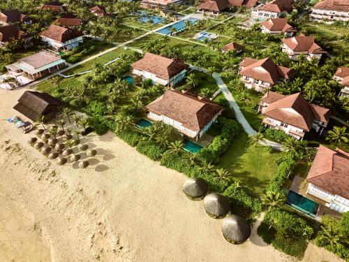 an aerial view of a house on the beach at ROBINSON Nam Hoi An in Tam Ky