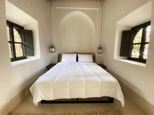 Postel nebo postele na pokoji v ubytování Villa les 3 Palmiers B&B