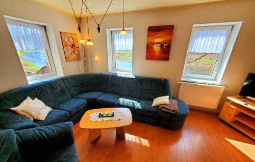 a living room with a couch and a coffee table at Café am Hirschgrund in Kurort Rathen