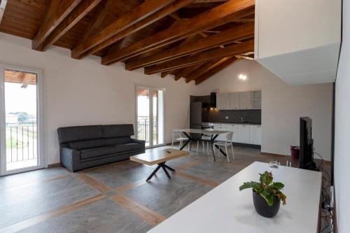 a living room with a couch and a table at Romana Luxury Suite - SELF CHECK-IN WI-FI in Oleggio