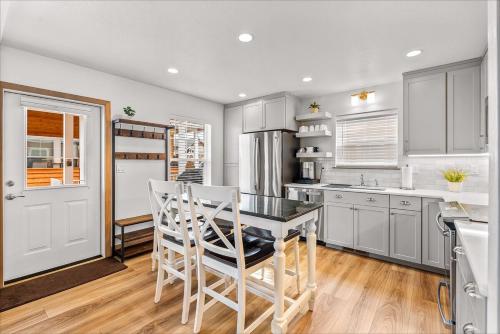 a kitchen with a table and chairs in it at Dover Wheelhouse in Dover