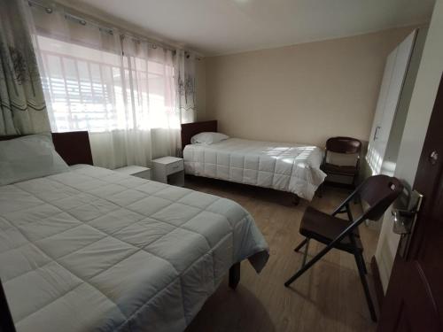 Ένα ή περισσότερα κρεβάτια σε δωμάτιο στο Hotel Victoria