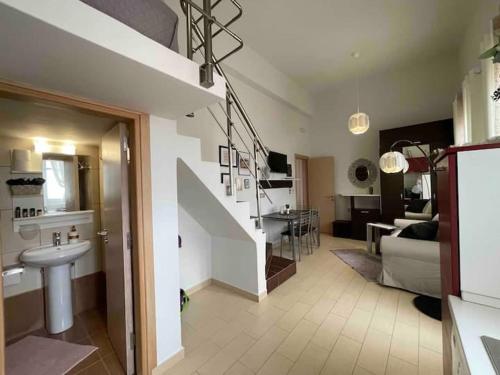 a living room with a sink and a staircase in a house at Kastelorizo suites in Meyisti