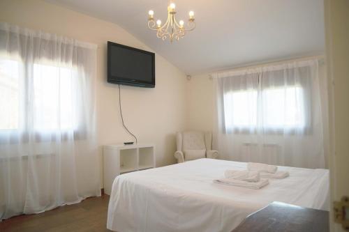 Ένα ή περισσότερα κρεβάτια σε δωμάτιο στο Casa das Buceleiras