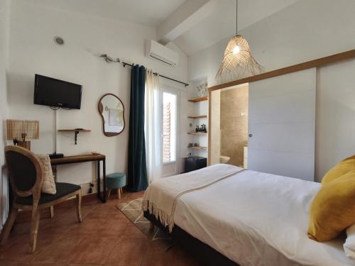 Un ou plusieurs lits dans un hébergement de l'établissement Chambres Isula Bella