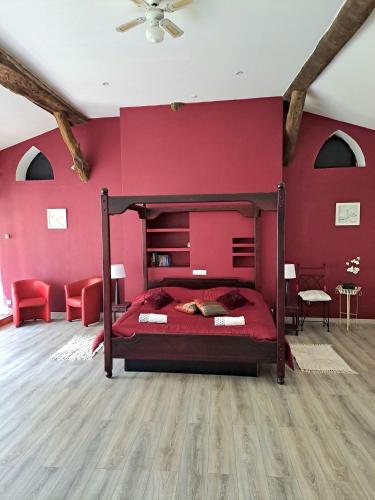Postel nebo postele na pokoji v ubytování Les chambres d'hôtes du Moulin