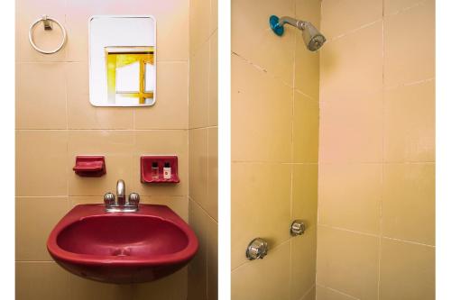 a bathroom with a red sink and a shower at OYO Posada De Los Angeles, Pátzcuaro in Pátzcuaro