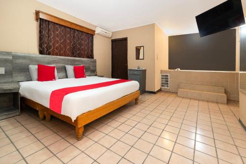 Postel nebo postele na pokoji v ubytování OYO Hotel Real Del Sur, Estadio Chihuahua
