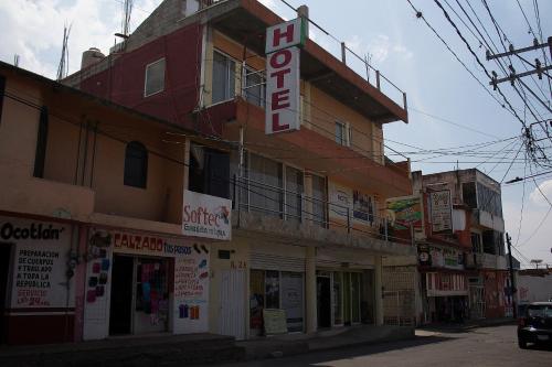 a building with a sign on the side of it at OYO Hotel Trigos De Oro,San Luis Teolocholco Park in San Luis Teolocholco