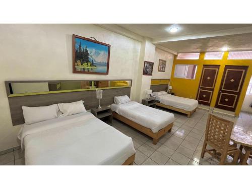 Katil atau katil-katil dalam bilik di OYO Hotel Museo Carnaval