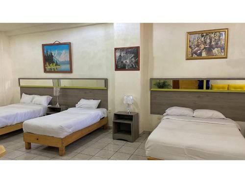 Katil atau katil-katil dalam bilik di OYO Hotel Museo Carnaval
