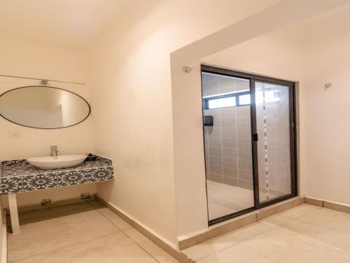 a bathroom with a sink and a mirror at Collection O Hotel Lavanda Anzures in Mexico City