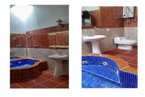 a bathroom with two sinks and a tub and a toilet at Capital O Posada Del Pescador Jocotepec in Chapala