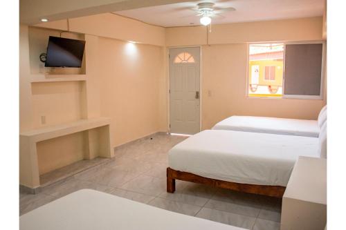 Un ou plusieurs lits dans un hébergement de l'établissement OYO Hotel La Playa