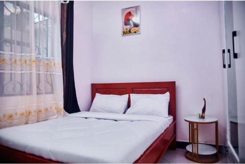 En eller flere senge i et værelse på Dema home