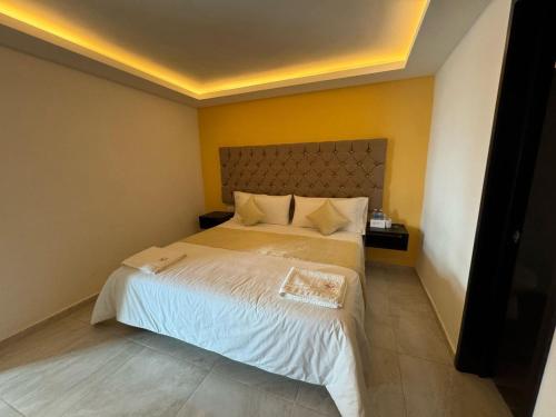 OYO Hotel Familiar Tollan Cholulaにあるベッド