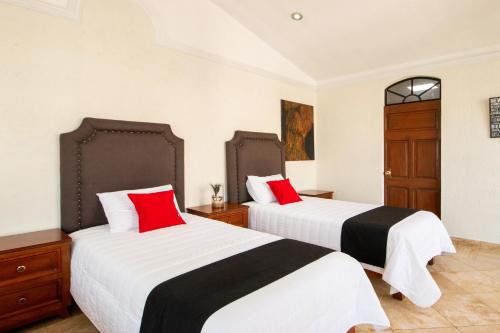 Ένα ή περισσότερα κρεβάτια σε δωμάτιο στο Capital O Hotel San Jose, San Luis Potosi