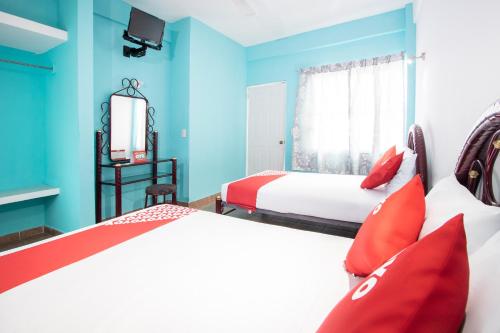 Postel nebo postele na pokoji v ubytování OYO Hotel Estacion,José Cardel,Parque Central Revolución