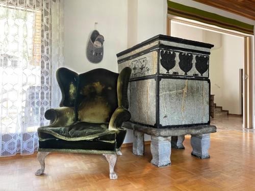 an old chair and a stove in a room at Apartment Fifinhaus by Interhome in Fiesch