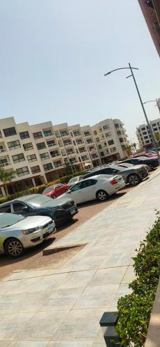 a row of parked cars in a parking lot at شالية غرفتين Porto Said in Port Said