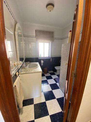 a bathroom with a sink and a toilet at La Casa de Domingo in Tózar