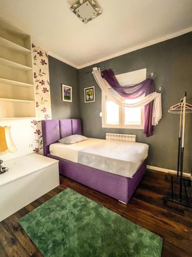 a bedroom with two beds and a window at Charming Countryside Villa with Garden & Terrace near Skadar Lake in Berislavci