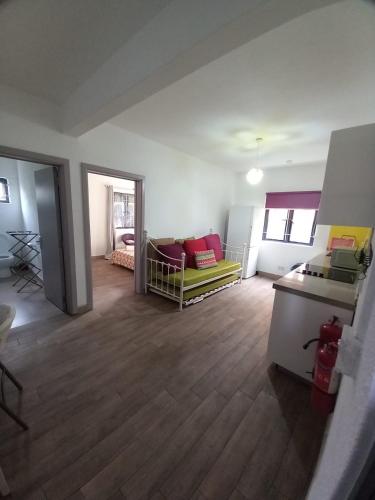 a living room with a couch and a table at Ibis Tourist Residence 1 in Mahébourg