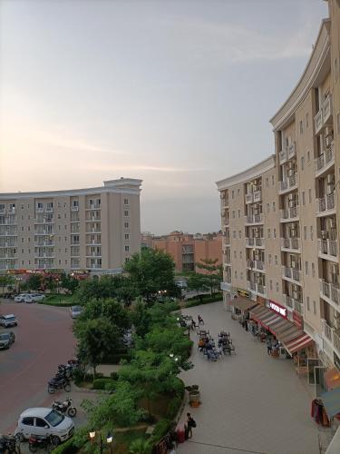 an aerial view of a parking lot with buildings at Mero vrindavan home stay in Chhatikara