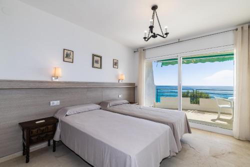Postel nebo postele na pokoji v ubytování Rentalmar Bahia Palace