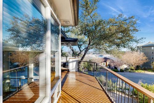 a balcony with a view of a house at Sailfish Sanctuary in Lakeway