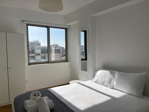 Ένα ή περισσότερα κρεβάτια σε δωμάτιο στο Spacious Apartment in Nicosia Landmark Hotel Area - Stasinou By Platform 357