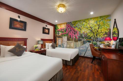 Postel nebo postele na pokoji v ubytování Bonjour D'An Nam Hotel