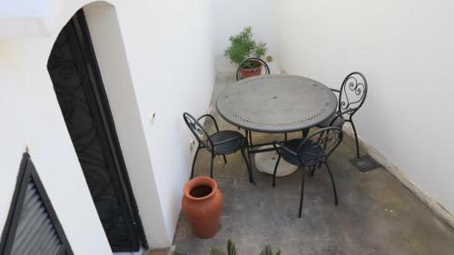 a table and chairs sitting on a patio at Cataldo Guest House in Capri