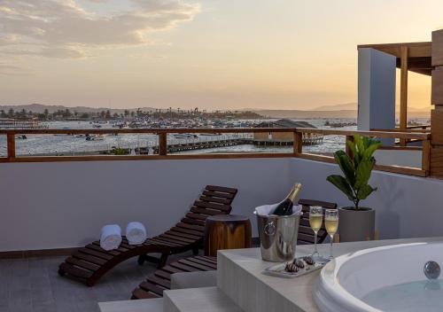 a bathroom with a tub and a view of the ocean at Aranwa Paracas Resort & Spa in Paracas