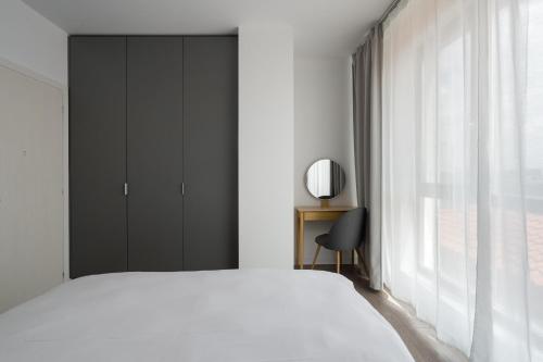 Postel nebo postele na pokoji v ubytování Class Residence Two - 2BR Suite