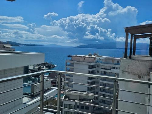 a view of the ocean from the balcony of a building at Amazing Sea View Apartment in Sarandë