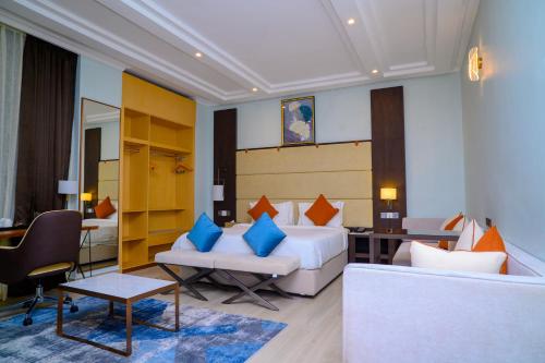 a hotel room with a bed and a couch at Best Western Dodoma City Hotel in Dodoma