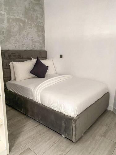 a bed in a room with a large mattress at Zen Studio Apt Lekki 1 in Ilado