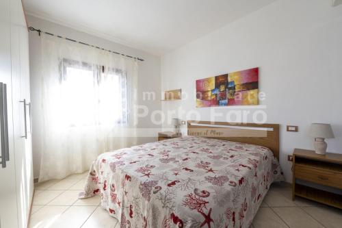 Ένα ή περισσότερα κρεβάτια σε δωμάτιο στο Via Bortigiadas 34 centrale - Bilocale in centro a Palau