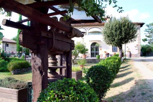 a bird house in front of a house at Agriturismo il Pino - Bioagricoltura in Monticello