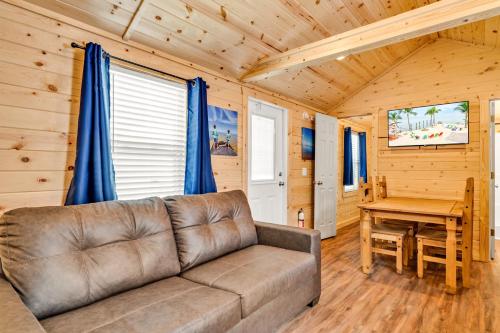 a living room with a couch and a table at Cabins at Bonefish Bay in Marathon
