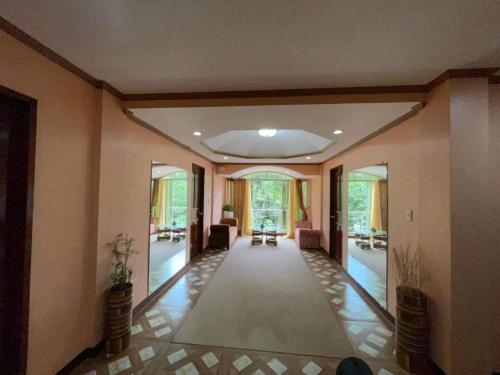 a hallway of a home with a living room at Casa Venicia Caticlan in Boracay