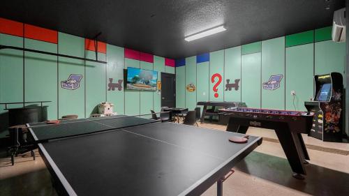 a ping pong room with a ping pong table at Upstay Family Home w Pool, Cinema & Games Room in Kissimmee