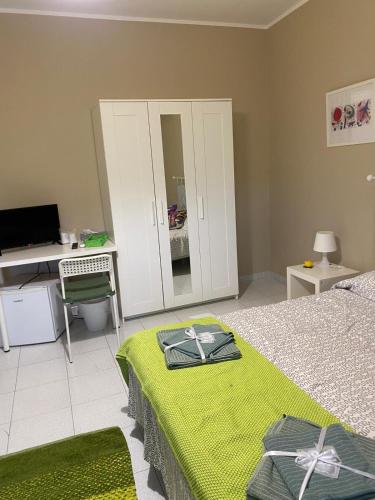 Ένα ή περισσότερα κρεβάτια σε δωμάτιο στο B&B Delle Zolfare