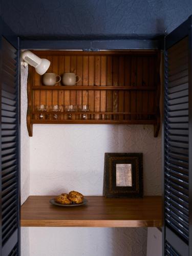 a plate of food on a shelf in a kitchen at Cambridge House in Windermere