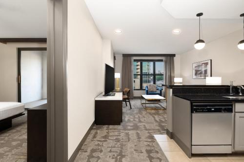 a room with a kitchen and a living room at Hilton Promenade Branson Landing in Branson