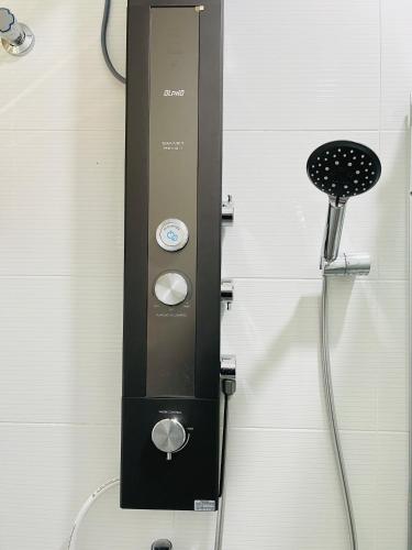 a soap dispenser is attached to a wall at Sofea Homestay Ipoh V2 in Ipoh
