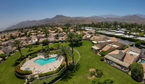 an aerial view of a community with houses and a swimming pool at Casitas Del Sol in Cathedral City