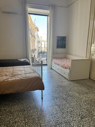 Letto o letti in una camera di Il Teatro Rooms
